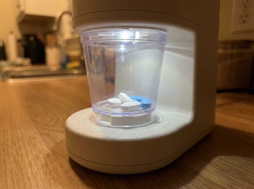 Illuminated dispensing cup on the Hero pill dispenser